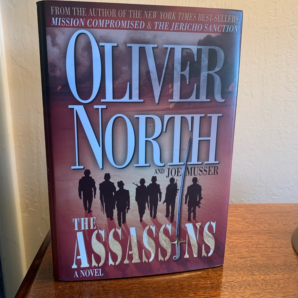 Singed by author, Fiction 1st edition 2005.  The Assassin by Oliver North.